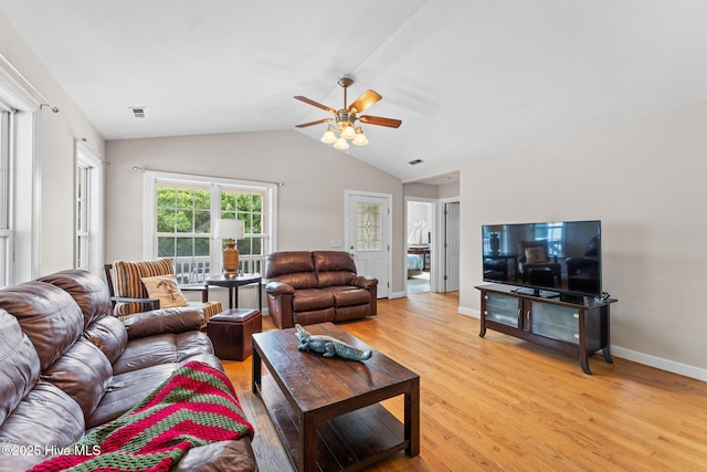 126 NE 5th St, Oak Island, NC 28465 - living area featuring light wood finished floors, ceiling fan, vaulted ceiling, and baseboards