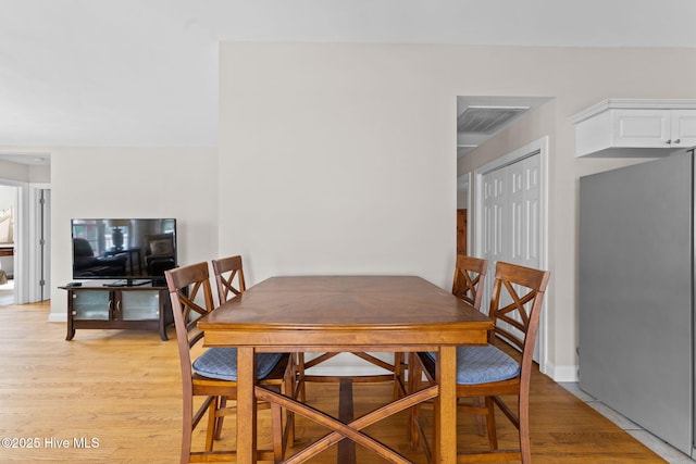 126 NE 5th St, Oak Island, NC 28465 - dining area featuring light wood-style floors