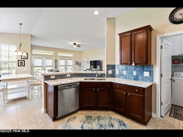1232 Fence Post Ln, Carolina Shores, NC 28467 - kitchen featuring dishwasher, a sink, a peninsula, open floor plan, and ceiling fan