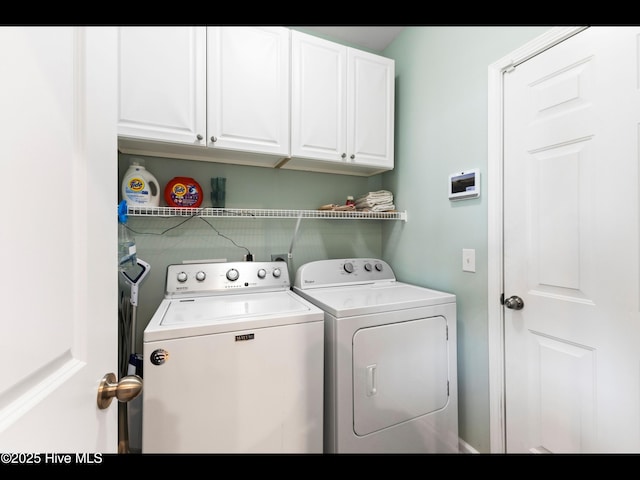 1232 Fence Post Ln, Carolina Shores, NC 28467 - laundry area with washing machine and clothes dryer and cabinet space