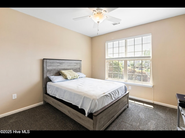 1232 Fence Post Ln, Carolina Shores, NC 28467 - carpeted bedroom with baseboards and a ceiling fan