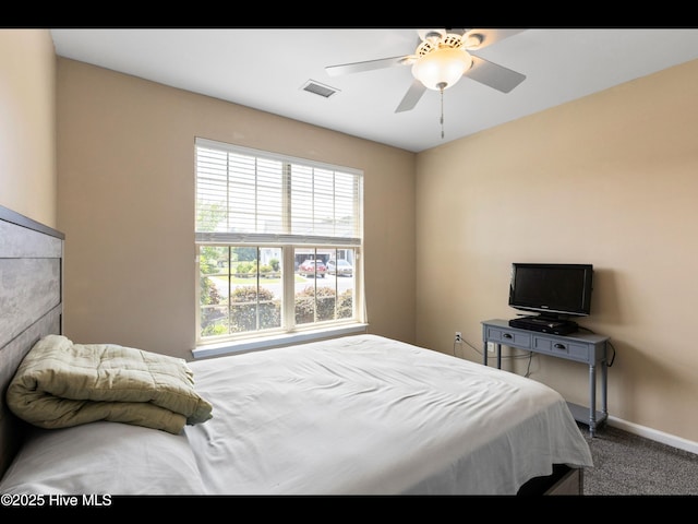 1232 Fence Post Ln, Carolina Shores, NC 28467 - bedroom featuring baseboards, carpet, and ceiling fan