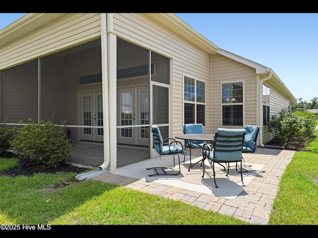 1232 Fence Post Ln, Carolina Shores, NC 28467 - view of patio with french doors and a sunroom