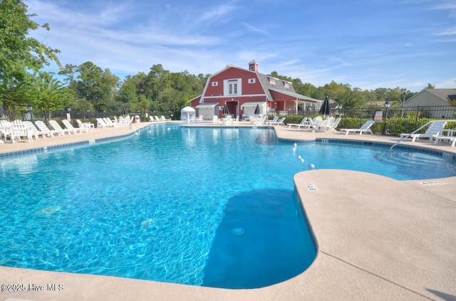 1232 Fence Post Ln, Carolina Shores, NC 28467 - community pool featuring a patio