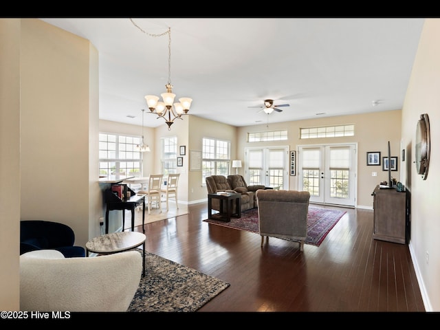 1232 Fence Post Ln, Carolina Shores, NC 28467 - living room featuring a chandelier, baseboards, a ceiling fan, and hardwood / wood-style flooring