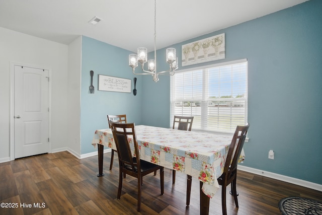 122 Mill Run Loop, South Mills, NC 27976 - dining room featuring a chandelier, dark wood-style flooring, and baseboards