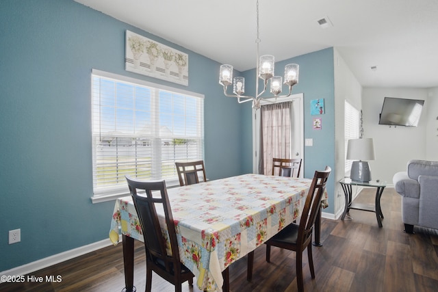122 Mill Run Loop, South Mills, NC 27976 - dining space with a chandelier, healthy amount of natural light, dark wood-style flooring, and baseboards