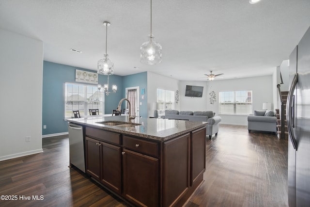 122 Mill Run Loop, South Mills, NC 27976 - kitchen featuring a sink, appliances with stainless steel finishes, dark brown cabinets, stone countertops, and dark wood-style floors