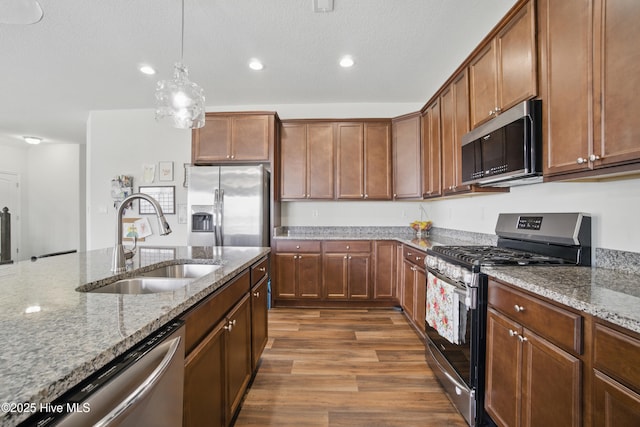 122 Mill Run Loop, South Mills, NC 27976 - kitchen featuring stainless steel appliances, a sink, recessed lighting, stone counters, and dark wood finished floors