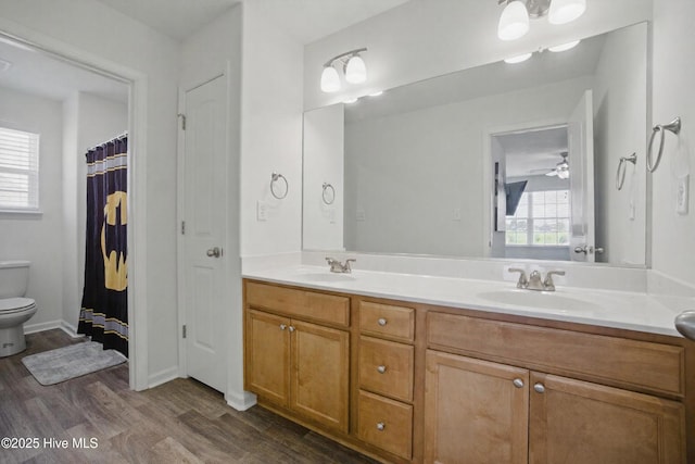122 Mill Run Loop, South Mills, NC 27976 - bathroom with double vanity, wood finished floors, and toilet