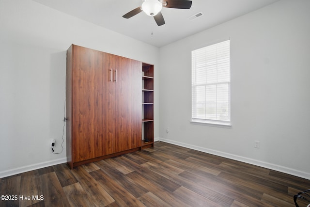 122 Mill Run Loop, South Mills, NC 27976 - unfurnished bedroom featuring dark wood finished floors, baseboards, and ceiling fan