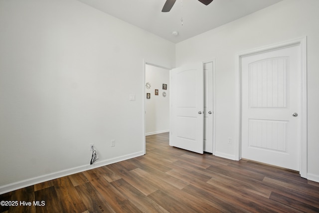 122 Mill Run Loop, South Mills, NC 27976 - unfurnished bedroom with dark wood-type flooring, baseboards, and a ceiling fan