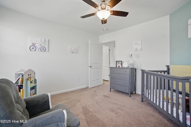 122 Mill Run Loop, South Mills, NC 27976 - carpeted bedroom featuring baseboards, a ceiling fan, and a crib