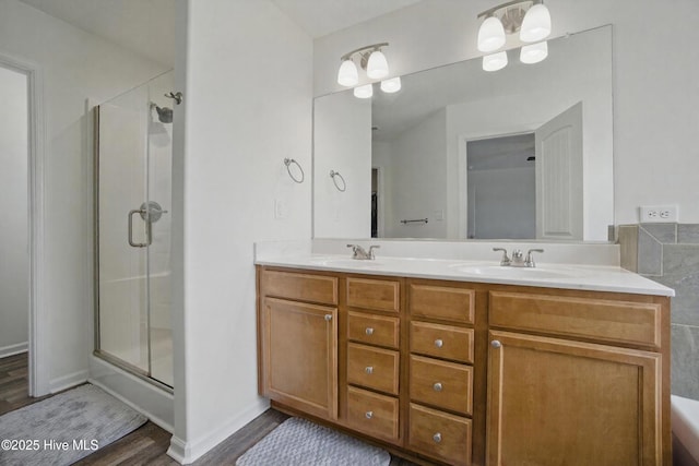 122 Mill Run Loop, South Mills, NC 27976 - bathroom featuring a stall shower, wood finished floors, and double vanity