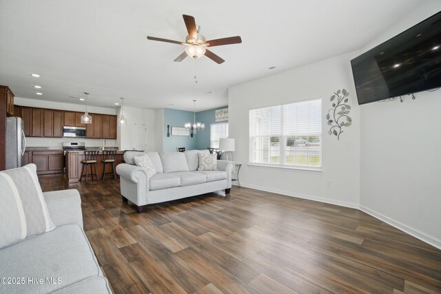 122 Mill Run Loop, South Mills, NC 27976 - living area featuring a ceiling fan, recessed lighting, dark wood-type flooring, a chandelier, and baseboards