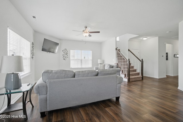 122 Mill Run Loop, South Mills, NC 27976 - living area featuring dark wood-style floors, a ceiling fan, stairway, and baseboards