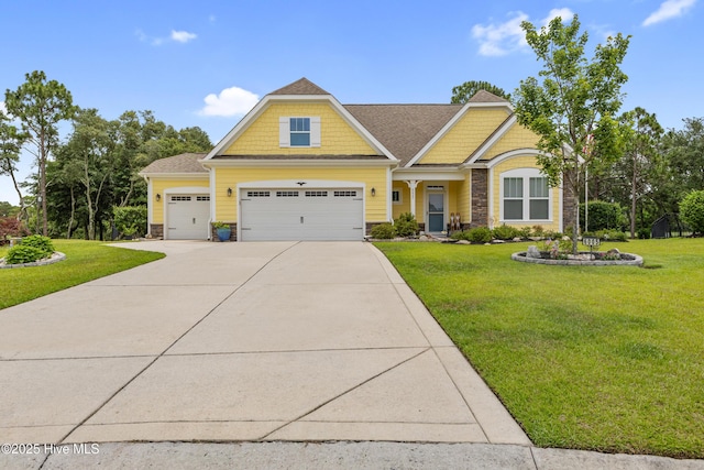 6005 Otter Tail Trl, Wilmington, NC 28412 - craftsman-style house featuring stone siding, driveway, a front lawn, and an attached garage