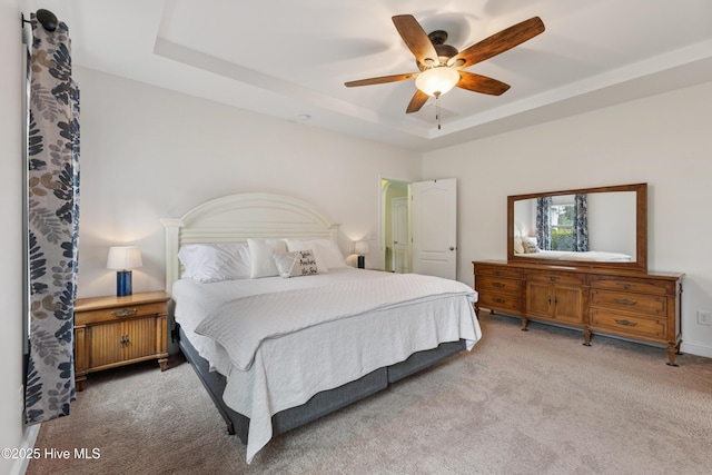 6005 Otter Tail Trl, Wilmington, NC 28412 - carpeted bedroom with a tray ceiling and a ceiling fan