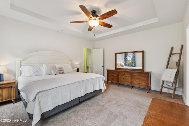 6005 Otter Tail Trl, Wilmington, NC 28412 - carpeted bedroom with a tray ceiling and a ceiling fan