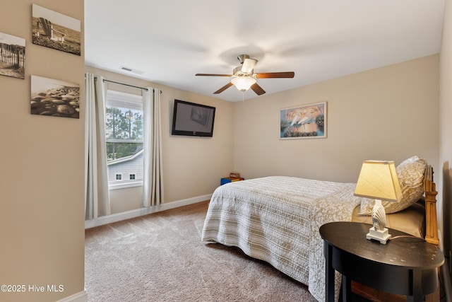 6005 Otter Tail Trl, Wilmington, NC 28412 - carpeted bedroom featuring baseboards and a ceiling fan
