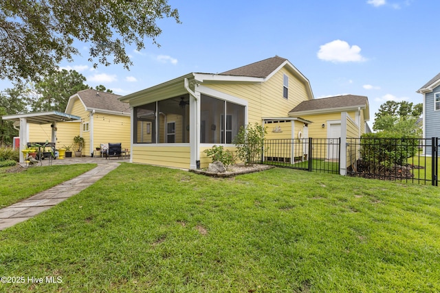 6005 Otter Tail Trl, Wilmington, NC 28412 - back of property featuring a sunroom, roof with shingles, and a patio