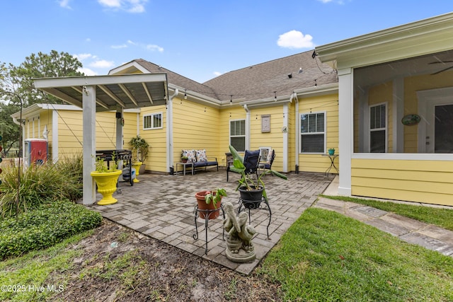 6005 Otter Tail Trl, Wilmington, NC 28412 - back of house featuring a patio area and a shingled roof