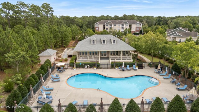 6005 Otter Tail Trl, Wilmington, NC 28412 - community pool with a patio area, stairs, and a view of trees