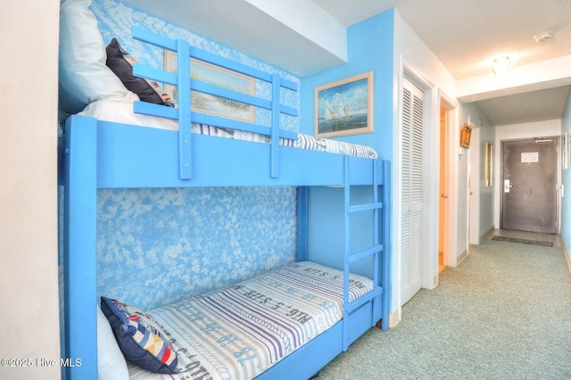 1615 Lake Park Blvd S Unit 307, Carolina Beach, NC 28428 - unfurnished bedroom with carpet flooring and a closet