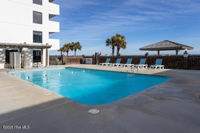 1615 Lake Park Blvd S Unit 307, Carolina Beach, NC 28428 - community pool with a patio area