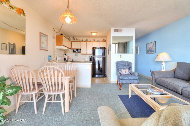1615 Lake Park Blvd S Unit 307, Carolina Beach, NC 28428 - living room with light carpet