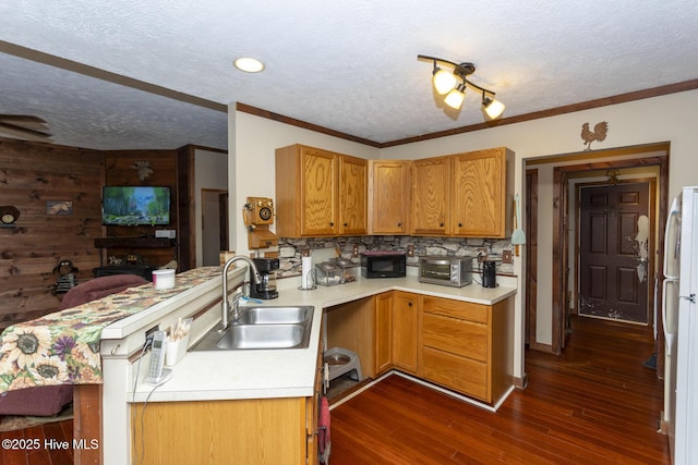 108 Western Trl, Carthage, NC 28327 - kitchen featuring a sink, light countertops, a textured ceiling, a peninsula, and black microwave
