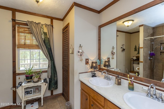 108 Western Trl, Carthage, NC 28327 - full bathroom with a textured ceiling, double vanity, tiled shower, tile patterned flooring, and toilet