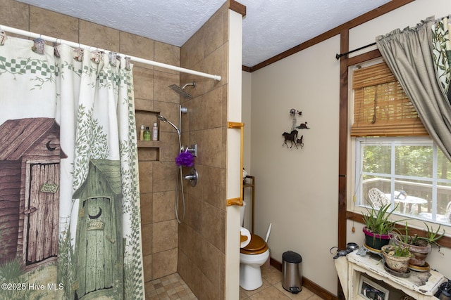 108 Western Trl, Carthage, NC 28327 - full bathroom featuring a stall shower, toilet, a textured ceiling, crown molding, and tile patterned flooring