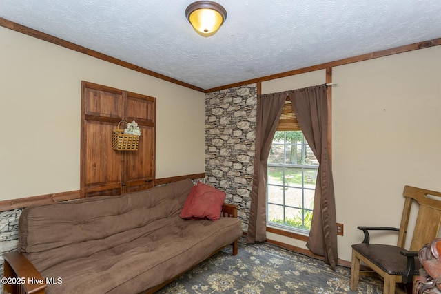 108 Western Trl, Carthage, NC 28327 - carpeted living area featuring a textured ceiling, ornamental molding, and baseboards