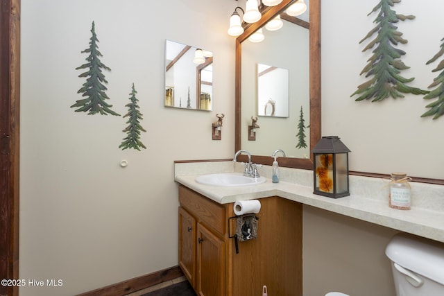 108 Western Trl, Carthage, NC 28327 - bathroom with toilet, vanity, and a chandelier