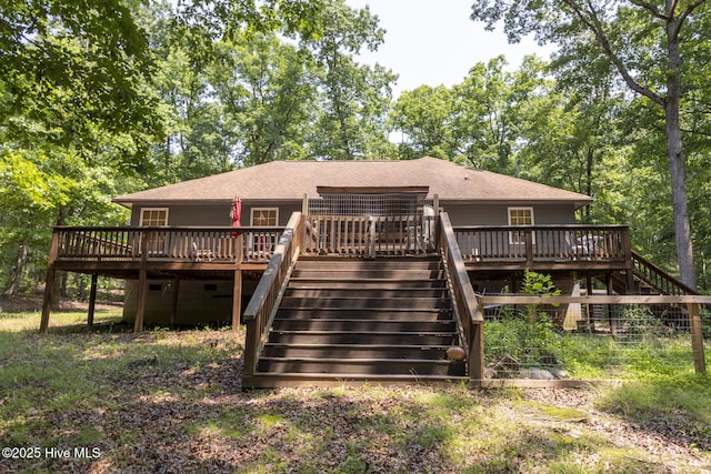 108 Western Trl, Carthage, NC 28327 - back of property with stairway, a deck, and a shingled roof
