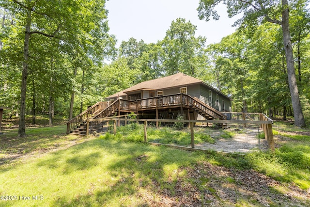 108 Western Trl, Carthage, NC 28327 - rear view of house with stairs, a deck, and a wooded view