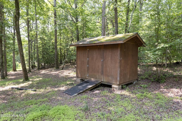 108 Western Trl, Carthage, NC 28327 - view of shed with a forest view