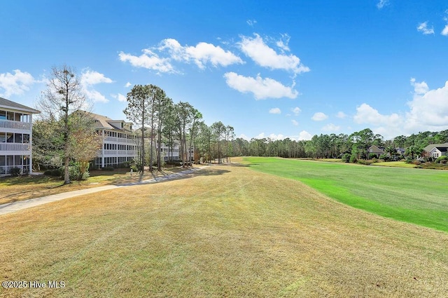 3350 Club Villas Dr # 105, Southport, NC 28461 - surrounding community with a lawn and golf course view