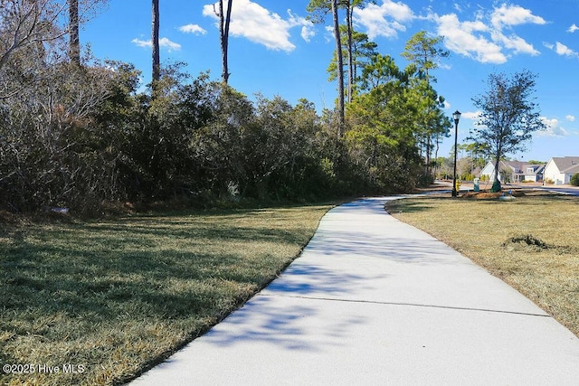 3350 Club Villas Dr # 105, Southport, NC 28461 - surrounding community featuring a yard
