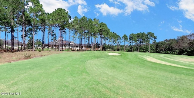 3350 Club Villas Dr # 105, Southport, NC 28461 - surrounding community with view of golf course and view of scattered trees