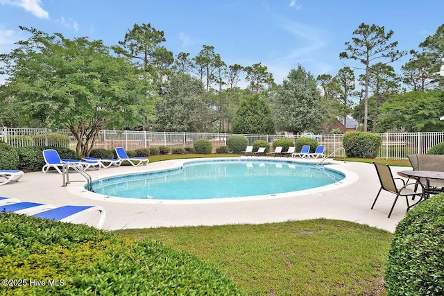 3350 Club Villas Dr # 105, Southport, NC 28461 - community pool featuring a patio area and view of wooded area