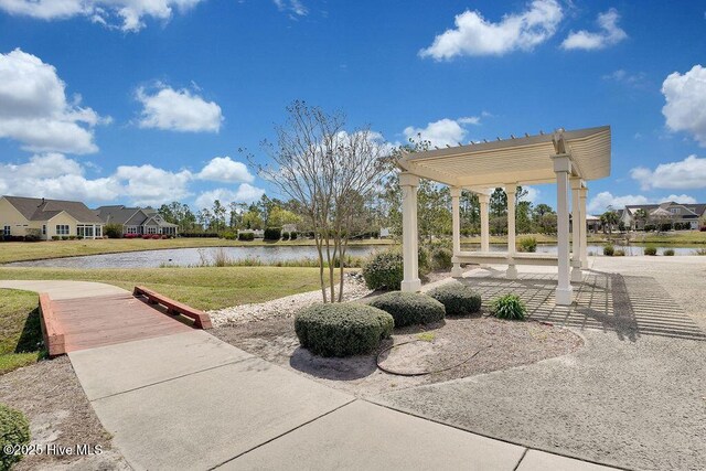 3350 Club Villas Dr # 105, Southport, NC 28461 - view of patio featuring a water view and a residential view