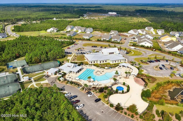 3350 Club Villas Dr # 105, Southport, NC 28461 - aerial view of property and surrounding area featuring a pool, a forest, and nearby suburban area