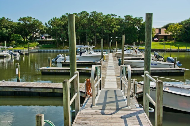 226 Oakleaf Dr, Pine Knoll Shores, NC 28512 - dock area featuring a water view and view of wooded area
