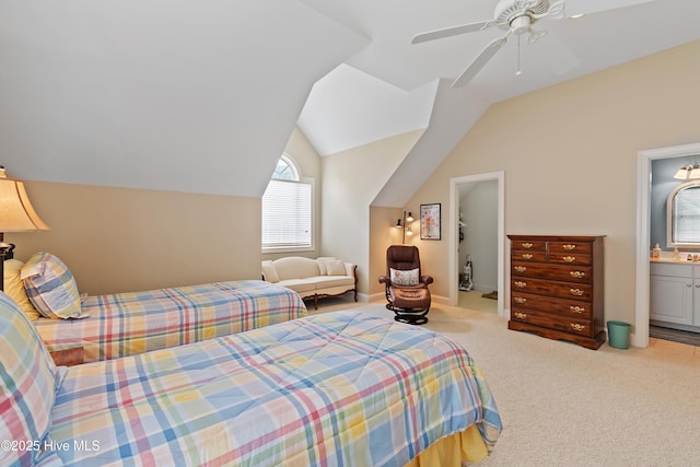 3254 Beaver Creek Dr SE, Southport, NC 28461 - carpeted bedroom featuring vaulted ceiling, ceiling fan, and ensuite bath