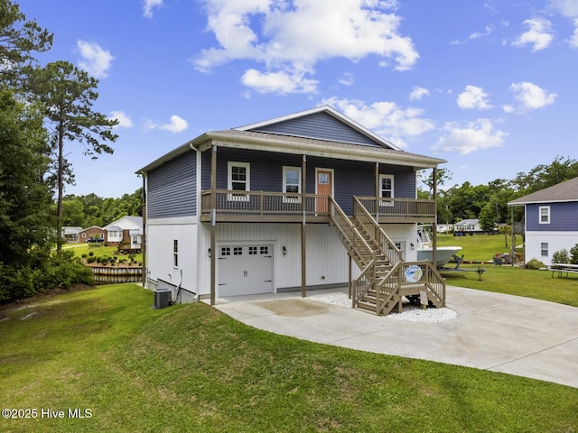 452 Crows Nest Ln, Sneads Ferry, NC 28460 - coastal inspired home with driveway, stairs, a front lawn, and an attached garage