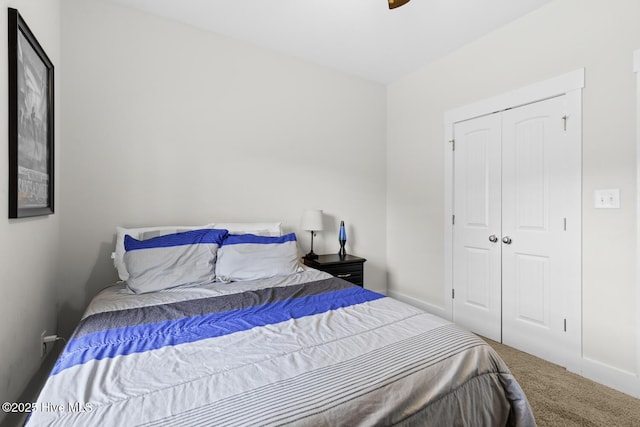 452 Crows Nest Ln, Sneads Ferry, NC 28460 - carpeted bedroom featuring a closet, baseboards, and a ceiling fan