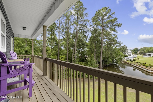 452 Crows Nest Ln, Sneads Ferry, NC 28460 - deck with a water view and view of wooded area