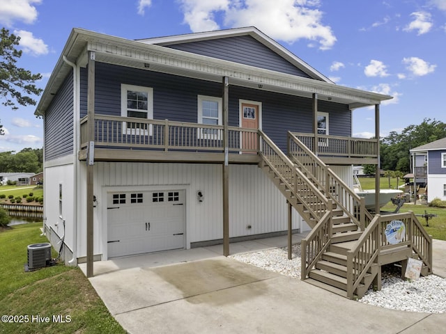 452 Crows Nest Ln, Sneads Ferry, NC 28460 - view of front facade with stairs, an attached garage, covered porch, and driveway